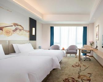 Vienna International Hotel (Changsha Ningxiang South Bus Station) - Changsha - Slaapkamer
