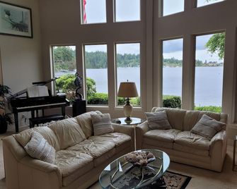 Beachfront Home With Sweeping Views of Water and Mount Baker - Port Ludlow - Living room