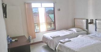 Avicenna Hotel - Palangkaraya - Bedroom