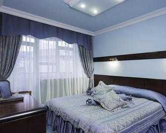 هوتل أوترار - ألماتي - غرفة نوم