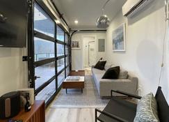 The Hideaway on Tacketts - Shipping Container - Hurricane - Living room