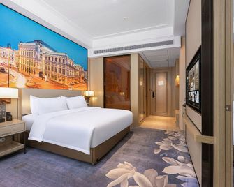 Vienna International Hotel Gansu Jiuquan Wanda Plaza - 酒泉 - 臥室
