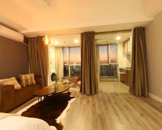 Suju Service Apartment (Shanghai International Tourism and Resorts Zone Zhoupu Wanda) - Szanghaj - Pokój dzienny