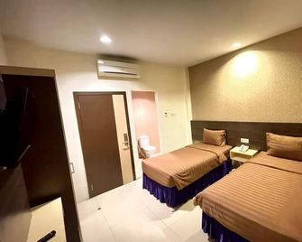 Atria Inn Makassar - Makassar - Habitación
