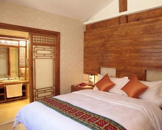 Lijiang Happyland Inn - Lijiang - Bedroom