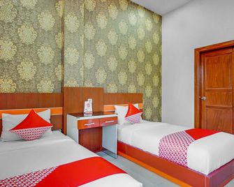 OYO 3157 Grand City Inn - Makassar - Bedroom