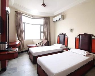 Naveen Hotel In Coimbatore - Coimbatore - Camera da letto