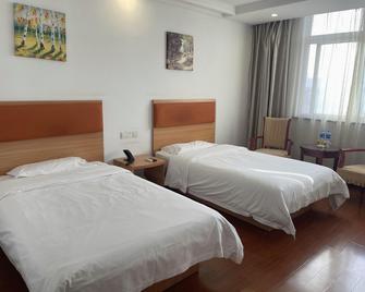 Home Inn Paibai Yun Hotel (Taizhou Wanda Plaza) - Taizhou - Habitación