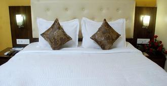 Mango Hotels Nagpur - Nagpur - Camera da letto