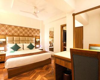 Click Hotel Nashik - นาสิก - ห้องนอน