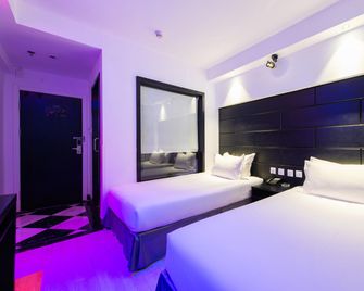 Watermelon Hotel (Dalian Zhongshan Square Railway Station Store) - Dalian - Dormitor