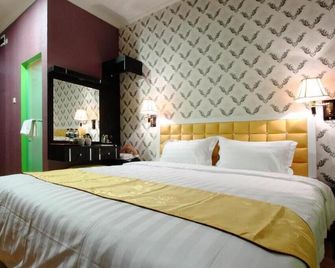 Hotel Rovi Boutique - ג'קרטה - חדר שינה