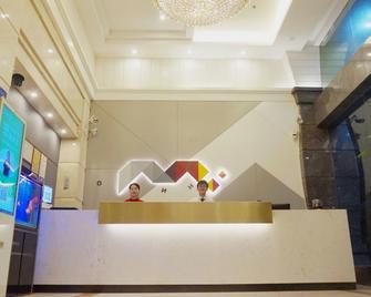 Jingtu Hotel Zhanjiang Dingsheng Plaza Store - Zhanjiang - Front desk