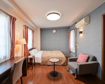 Obama Town Hotel - Unzen - Slaapkamer