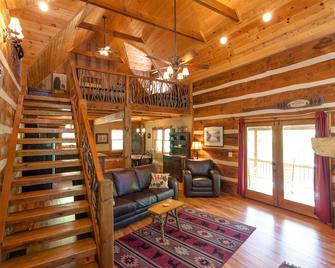 Creekside Cabin - Log Cabin with Outdoor Hot Tub - Hot Springs - Living room