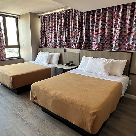 Bedroom view of Regal Inn & Suites New York Laguardia Hotel