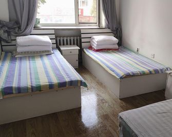 Warm and Cozy Hotel (Harbin East Railway Station Branch) - Harbin - Soveværelse