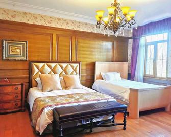 Baden Town Hot Spring Villa - Qingdao - Bedroom