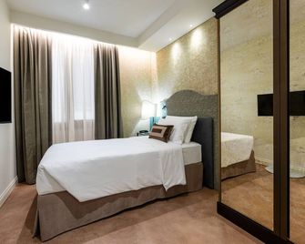 هوتل آكا - البندقية - غرفة نوم