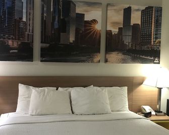 Days Inn & Suites by Wyndham Romeoville - Romeoville - Slaapkamer