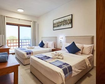 Malika Nungwi Hotel - ננגווי - חדר שינה