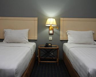 Sandakan Inn - Сандакан - Спальня