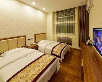 Shell Zhaozhong Ancient Street, Jinzhong County Railway Station Hotel - Jinzhong - Bedroom