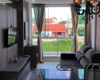 Brand new apartment (102) for your vacation on a beautiful beach - Porto Belo - Living room