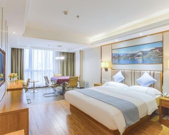 Wodun Platinum Hotel (Qinzhou East Railway Station Niannianfeng Plaza) - Qinzhou - Schlafzimmer