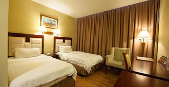 Gaya Centre Hotel - קוטה קינבאלו - חדר שינה