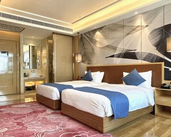 Wuhan Wellton Yiju Hotel - Wuhan - Schlafzimmer