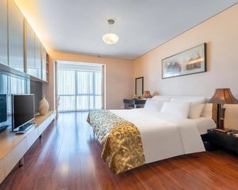 Qingdao Housing International Hotel - Qingdao - Slaapkamer