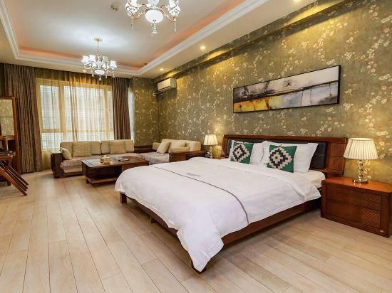 Xingangjing Apartment Hotel(Dalian Harbor Plaza International Conference Center store) - Dalian - Bedroom