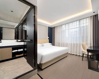 Bolun Hotel (Harbin International Convention and Exhibition Center Gongda Second Campus Branch) - Harbin - Bedroom