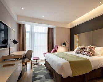 Campanile Hotel Wuhan Zhongnan Road Metro Station - Wu-chan - Ložnice