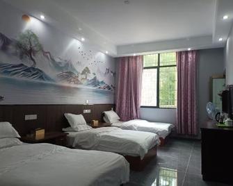 Qingxi Guotai Hotel - Guangyuan - Schlafzimmer