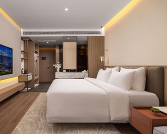 Yellow River Xiyu Hotel (City View Branch) - Zhongwei - Schlafzimmer