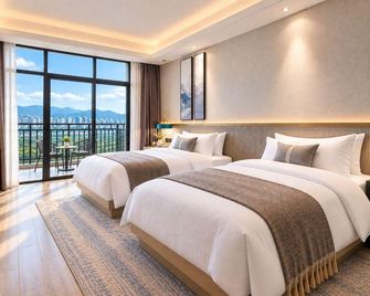 Xishuangbanna Yunheyuan Hotel - Xishuangbanna - Soveværelse