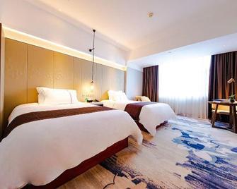 Liyuan Hotel (Hezhou Lingfeng Plaza Branch) - Hezhou - Bedroom
