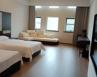 Bo Xuan Hotel (Beijing Yungang Nangong) - Pekín - Habitación