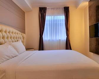 Ritzton Hotel - Йогор Багру - Спальня