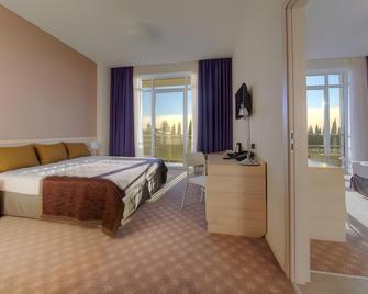 Sport Inn Hotel - Soci - Camera da letto