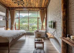 Autumn Inn - Guilin - Camera da letto