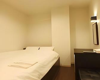 Relaxation & Spa Hotel Nexel - טוקושימה - חדר שינה