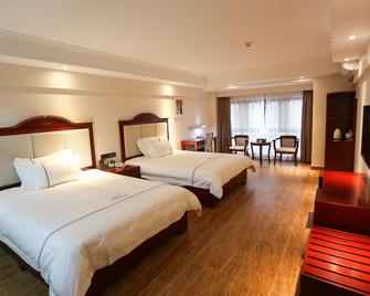Qinyuan Holiday Hotel (Chizhou High-speed Railway Station) - Chizhou - Slaapkamer