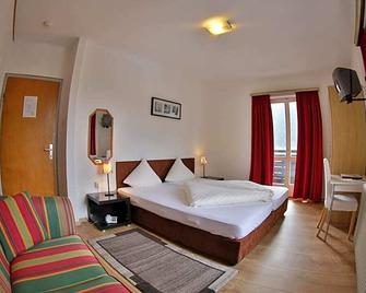 Aparthotel Tante Trude - اويتز - غرفة نوم