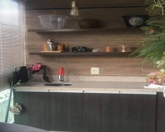 A space facing greenery and close to the most beautiful beaches in Rio de Janeiro - Rio de Janeiro - Kitchen