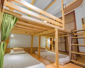 يوان تشي هوستل - مدينة تاينان - غرفة نوم