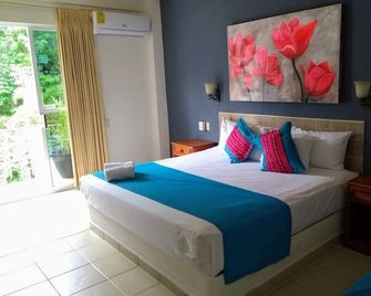 Hotel Arenas del Pacifico - La Crucecita - Camera da letto