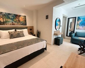 Taga Hotel - Bitez - Ložnice